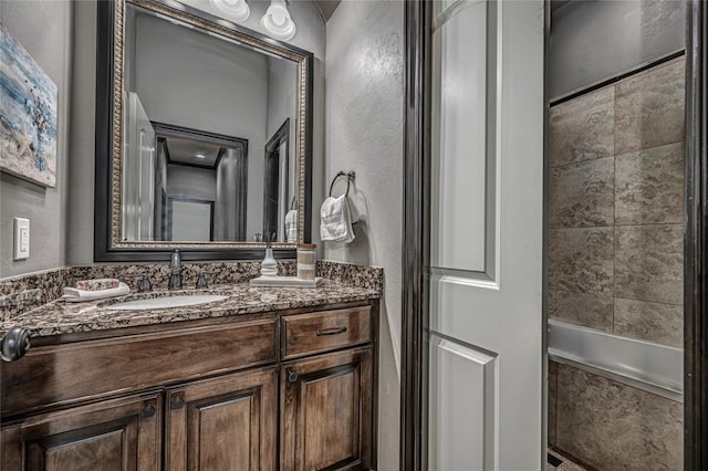 8521 NW 124th St, Oklahoma City, OK 73142 - bathroom featuring vanity and a textured wall