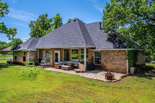 back of house with a patio, roof with shingles, brick siding, an outdoor living space, and a yard