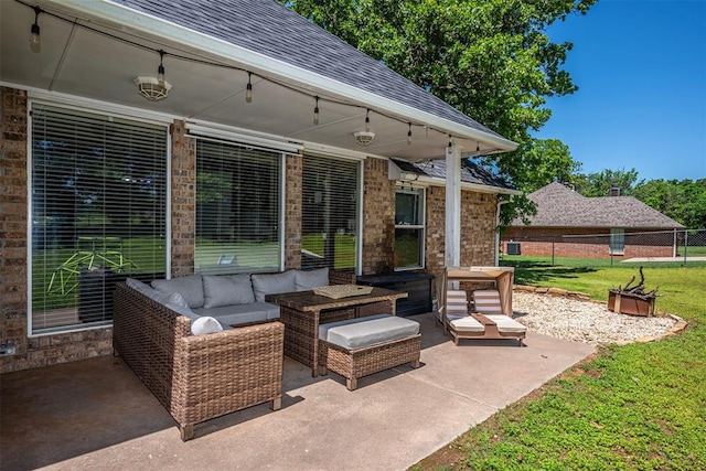 view of patio featuring fence and an outdoor hangout area