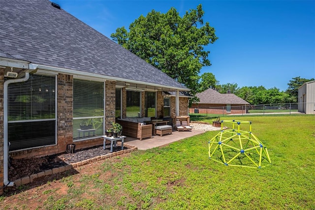 view of yard featuring fence, a patio, and an outdoor hangout area