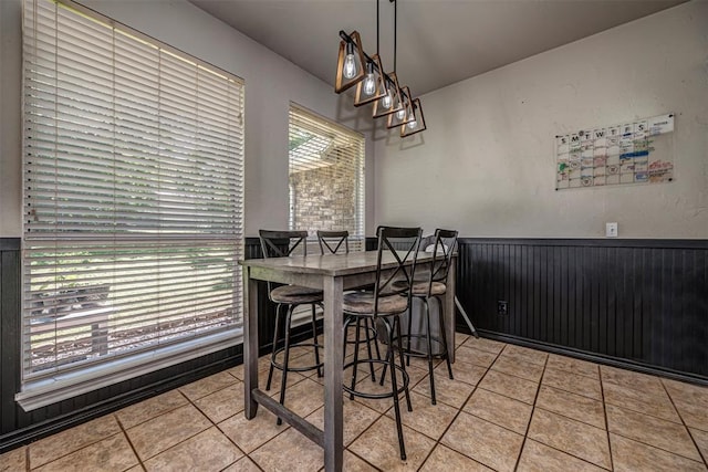 dining space featuring light tile patterned floors
