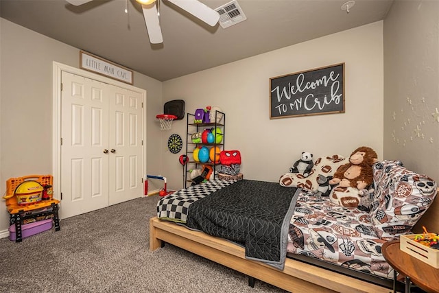 carpeted bedroom featuring a ceiling fan and visible vents
