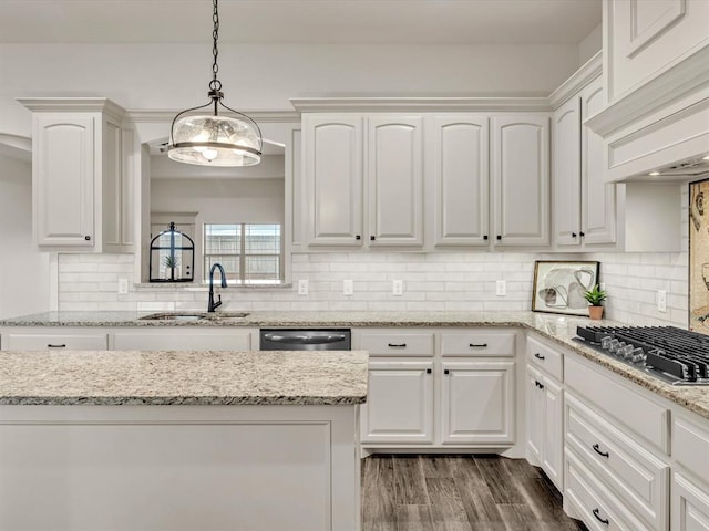 kitchen featuring white cabinets, appliances with stainless steel finishes, a sink, pendant lighting, and custom exhaust hood