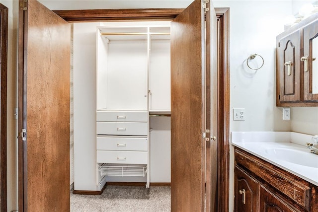 bathroom with baseboards and vanity