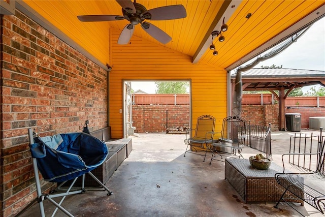 view of patio / terrace with a gazebo, ceiling fan, fence, and grilling area