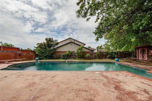 view of swimming pool featuring a patio, a fenced backyard, and a fenced in pool