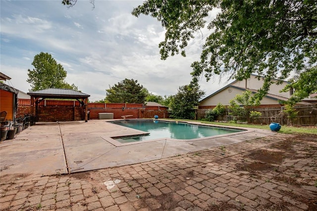 view of swimming pool with a fenced backyard, a fenced in pool, a patio, and a gazebo