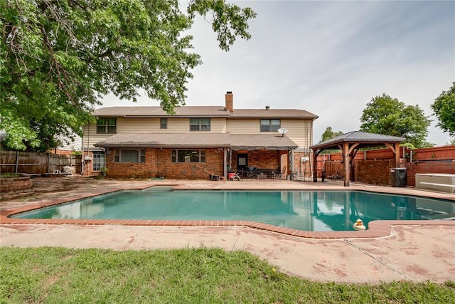 view of swimming pool with a fenced in pool, a gazebo, fence private yard, and a patio area