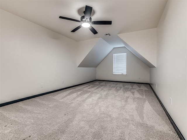 additional living space featuring visible vents, carpet, ceiling fan, and baseboards