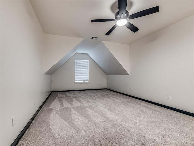 bonus room with visible vents, carpet floors, baseboards, a ceiling fan, and vaulted ceiling