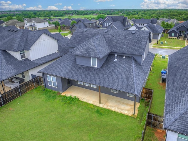 birds eye view of property with a residential view