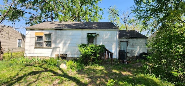 exterior space with a lawn and fence