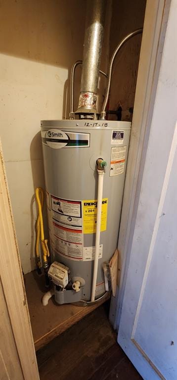 utility room with water heater