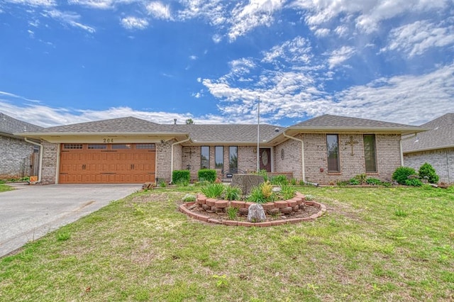 204 Sequoia Park Dr, Yukon, OK 73099 - ranch-style house featuring aphalt driveway, an attached garage, a front lawn, and brick siding