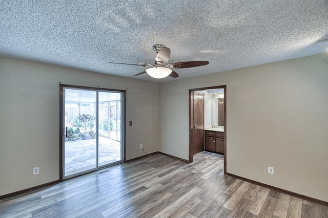 204 Sequoia Park Dr, Yukon, OK 73099 - empty room featuring baseboards, ceiling fan, light wood-type flooring, and a textured ceiling