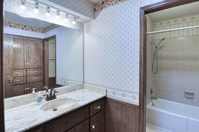204 Sequoia Park Dr, Yukon, OK 73099 - full bathroom with shower / bath combination, vanity, a textured ceiling, and wallpapered walls
