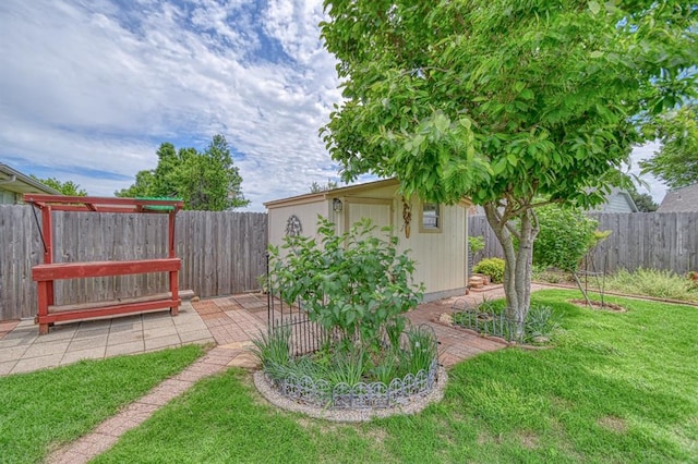 204 Sequoia Park Dr, Yukon, OK 73099 - view of yard featuring an outdoor structure, a fenced backyard, and a shed