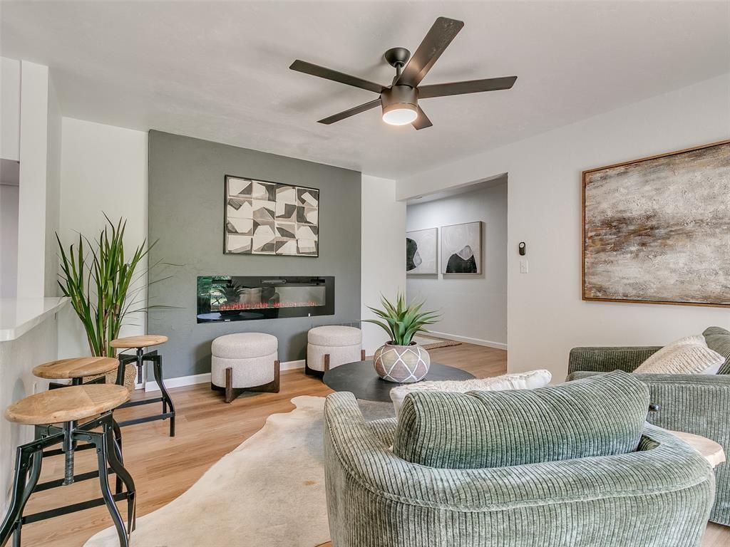 4512 SE 50th St, Oklahoma City, OK 73135 - living room with ceiling fan, light wood-style floors, and baseboards