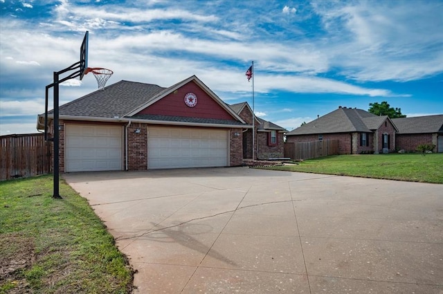 view of front of house with brick siding, an attached garage, fence, and driveway