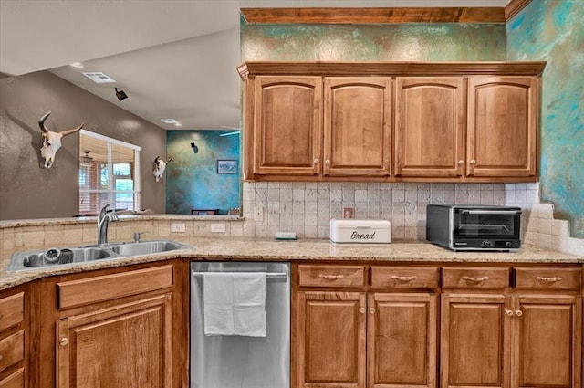 kitchen with stainless steel dishwasher, a sink, decorative backsplash, and visible vents