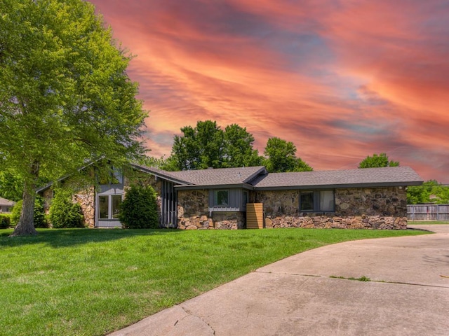 3233 Hickory Stick Rd, Oklahoma City, OK 73120 - mid-century inspired home with stone siding, a yard, and concrete driveway