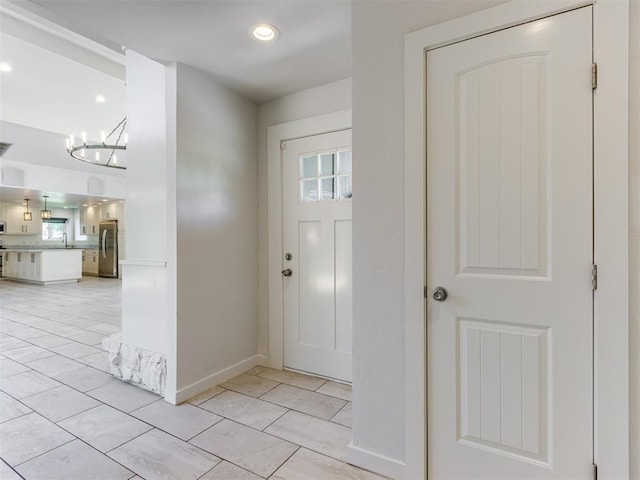 3233 Hickory Stick Rd, Oklahoma City, OK 73120 - entryway with a chandelier, light tile patterned flooring, and recessed lighting