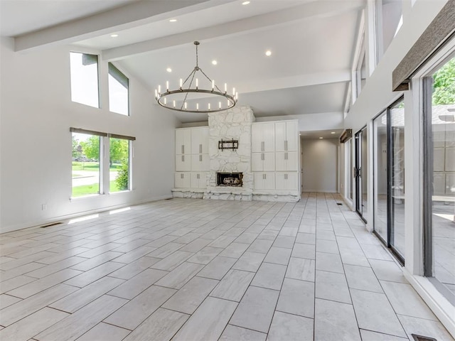 3233 Hickory Stick Rd, Oklahoma City, OK 73120 - unfurnished living room featuring beamed ceiling, high vaulted ceiling, a chandelier, healthy amount of natural light, and a fireplace