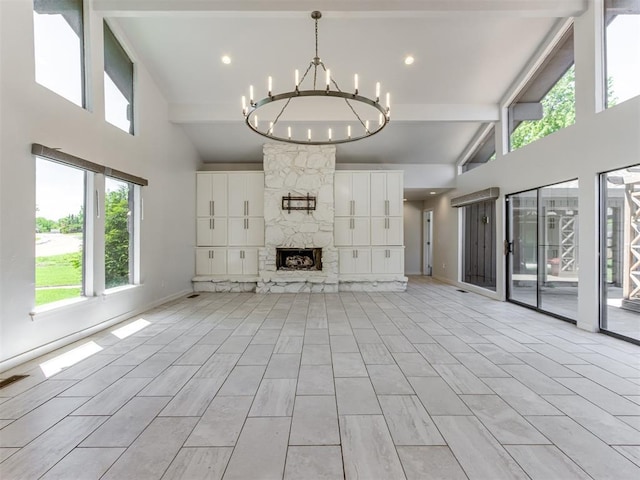 3233 Hickory Stick Rd, Oklahoma City, OK 73120 - unfurnished living room with high vaulted ceiling, a chandelier, healthy amount of natural light, a stone fireplace, and beam ceiling