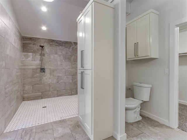 3233 Hickory Stick Rd, Oklahoma City, OK 73120 - bathroom with tiled shower, a closet, and recessed lighting