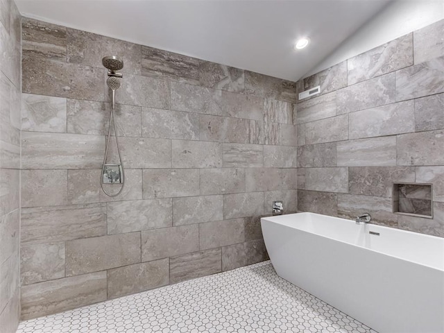 3233 Hickory Stick Rd, Oklahoma City, OK 73120 - full bathroom with a soaking tub, tiled shower, tile walls, and lofted ceiling