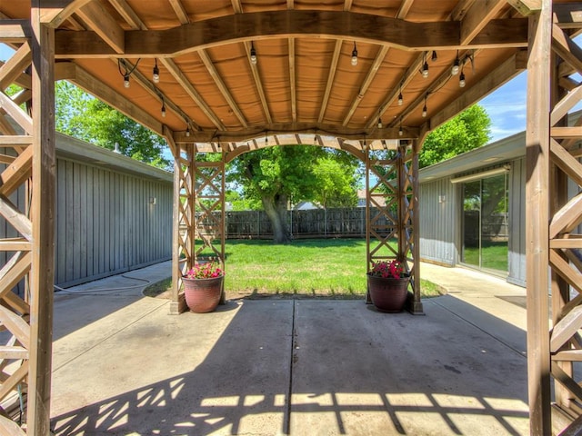 3233 Hickory Stick Rd, Oklahoma City, OK 73120 - fenced backyard with a patio area
