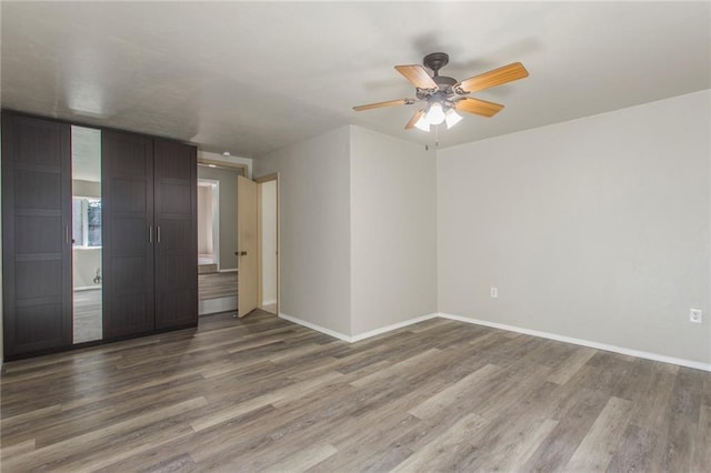 556 SW 52nd St, Oklahoma City, OK 73109 - spare room with baseboards, a ceiling fan, and wood finished floors