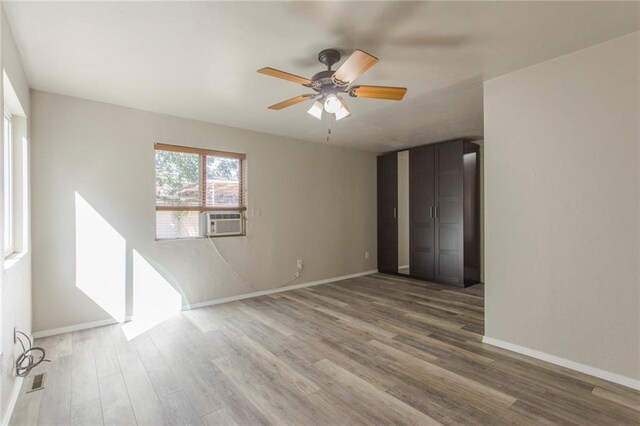 556 SW 52nd St, Oklahoma City, OK 73109 - spare room with baseboards, ceiling fan, and wood finished floors
