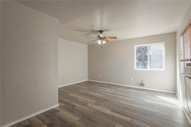 556 SW 52nd St, Oklahoma City, OK 73109 - spare room featuring baseboards, ceiling fan, and wood finished floors