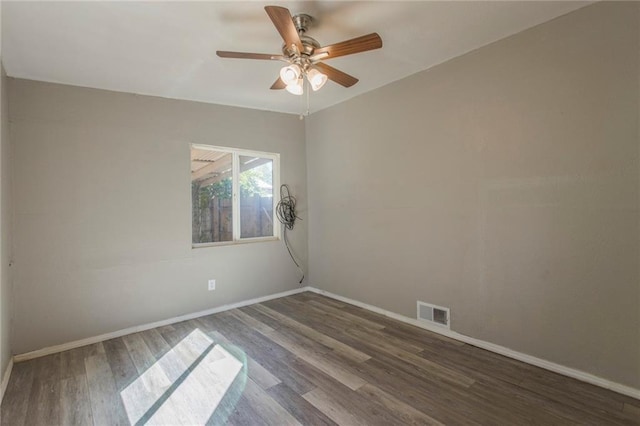 556 SW 52nd St, Oklahoma City, OK 73109 - spare room with a ceiling fan, baseboards, visible vents, and wood finished floors