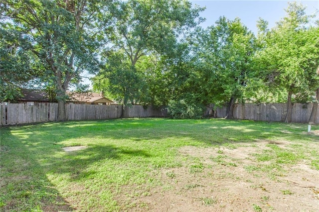 556 SW 52nd St, Oklahoma City, OK 73109 - view of yard featuring a fenced backyard