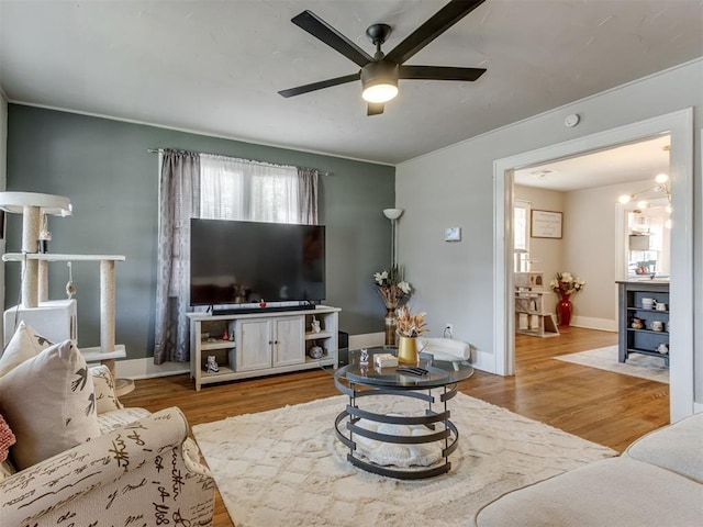 2247 NW 35th St, Oklahoma City, OK 73112 - living area featuring baseboards, ceiling fan, and wood finished floors