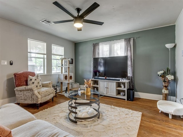 2247 NW 35th St, Oklahoma City, OK 73112 - living area featuring visible vents, a ceiling fan, baseboards, and wood finished floors