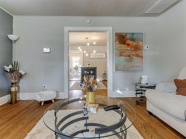 2247 NW 35th St, Oklahoma City, OK 73112 - living area featuring visible vents, baseboards, and wood finished floors