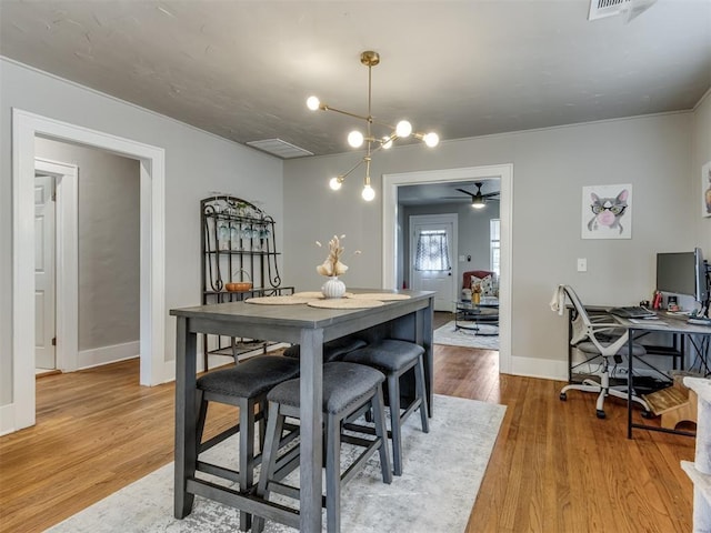 2247 NW 35th St, Oklahoma City, OK 73112 - dining space with baseboards, a ceiling fan, light wood finished floors, and visible vents
