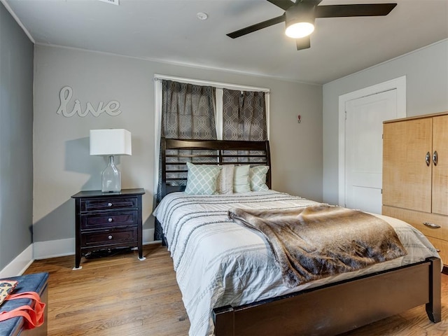 2247 NW 35th St, Oklahoma City, OK 73112 - bedroom featuring baseboards, a ceiling fan, and wood finished floors