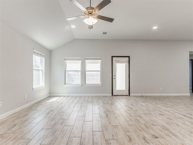unfurnished room with ceiling fan, lofted ceiling, light wood-style flooring, and visible vents
