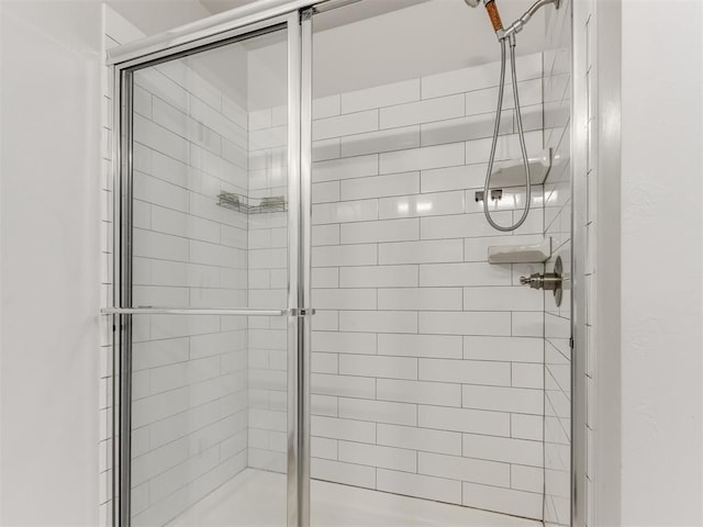 full bathroom featuring a shower stall