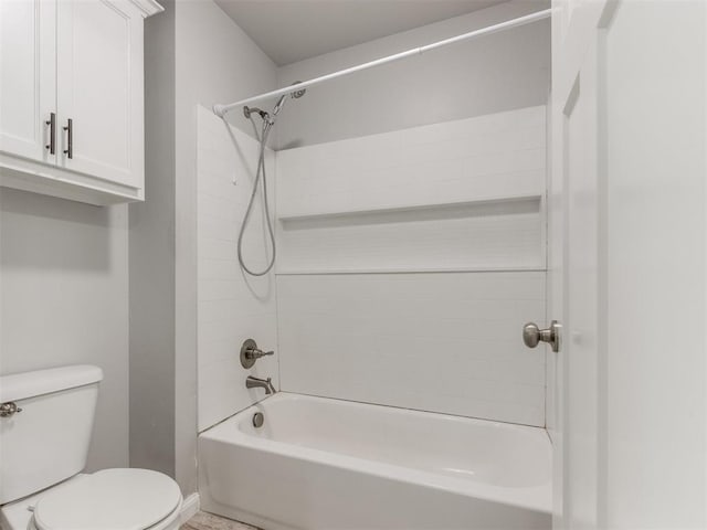 full bath featuring shower / tub combination, baseboards, and toilet