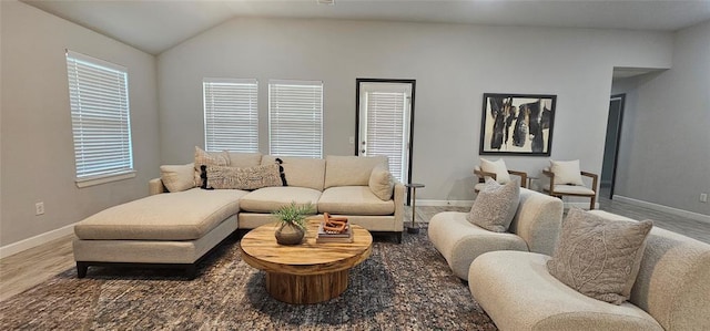 12929 NW 4th St, Yukon, OK 73099 - living area featuring wood finished floors, lofted ceiling, and baseboards