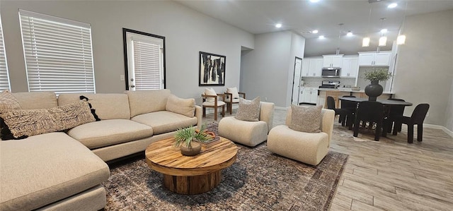 12929 NW 4th St, Yukon, OK 73099 - living room with light wood-type flooring, baseboards, and recessed lighting