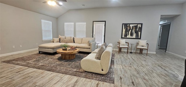 12929 NW 4th St, Yukon, OK 73099 - living area with ceiling fan, wood finished floors, baseboards, and vaulted ceiling