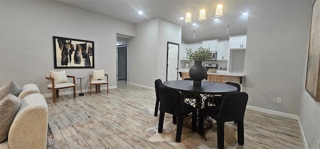 12929 NW 4th St, Yukon, OK 73099 - dining area with light wood finished floors, baseboards, and recessed lighting