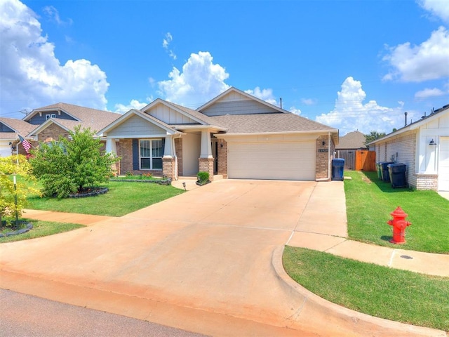 12929 NW 4th St, Yukon, OK 73099 - view of front of property featuring brick siding, an attached garage, and driveway