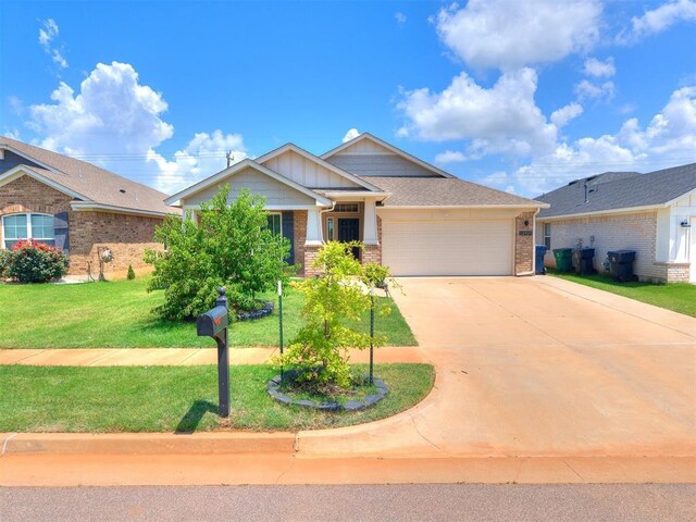 12929 NW 4th St, Yukon, OK 73099 - view of front of house featuring brick siding, a garage, driveway, and a front yard